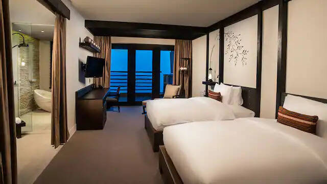 TWO TWIN BEDS WITH MOUNTAIN VIEW